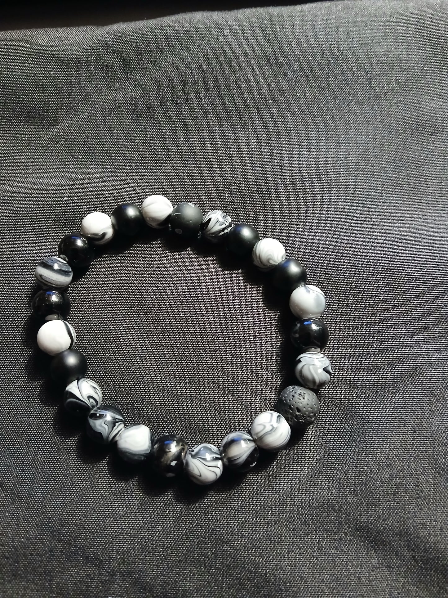 Handmade black, gray, and white bracelet.