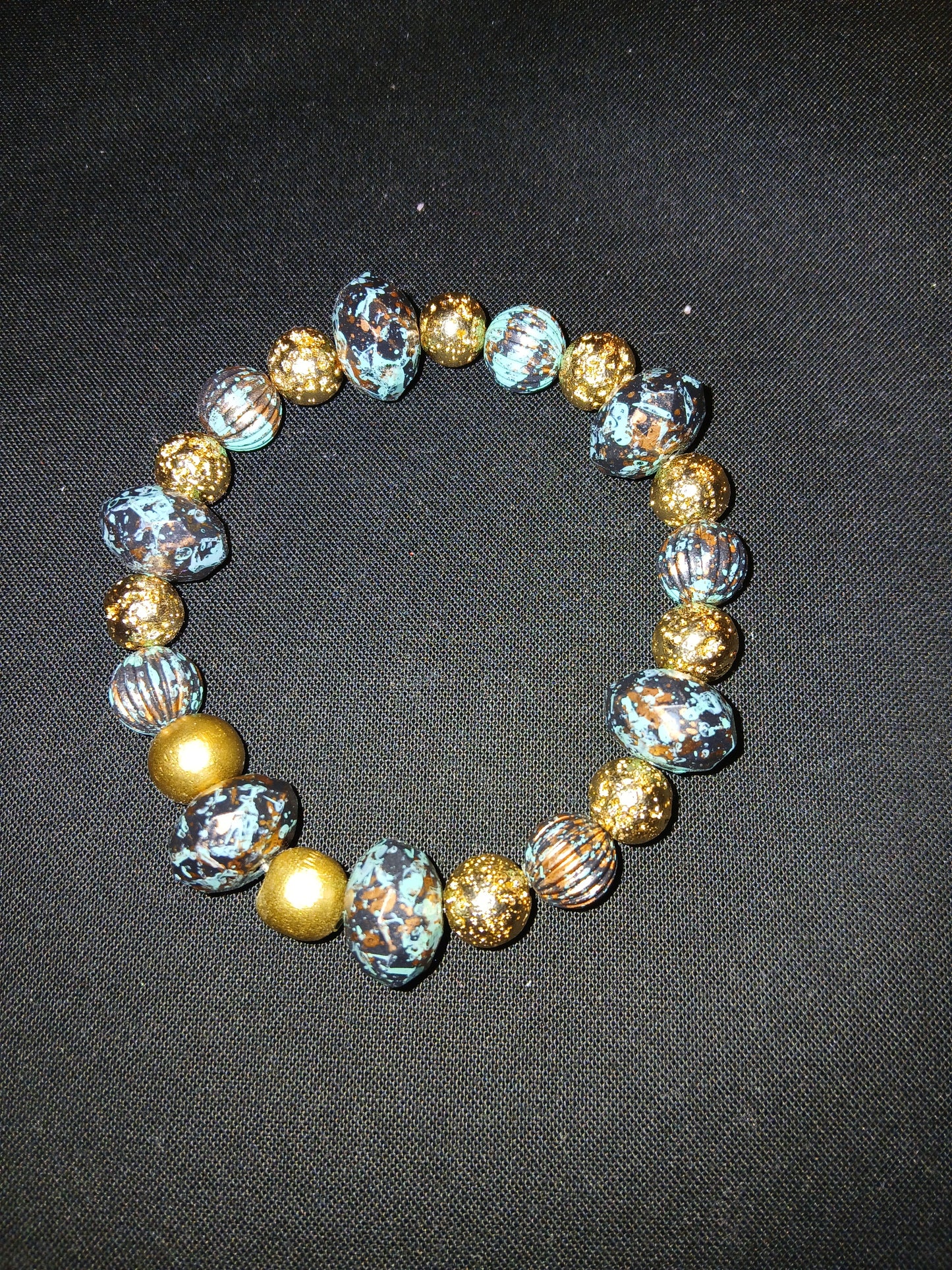 Handmade blue, bronze, black and gold bracelet.