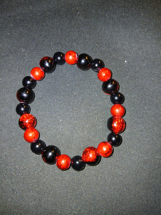 Handmade multi colored black and red beads bracelet.