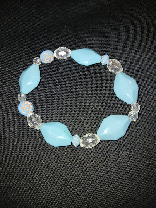 Handmade geometric shaped blue , clear, and beige bracelet.