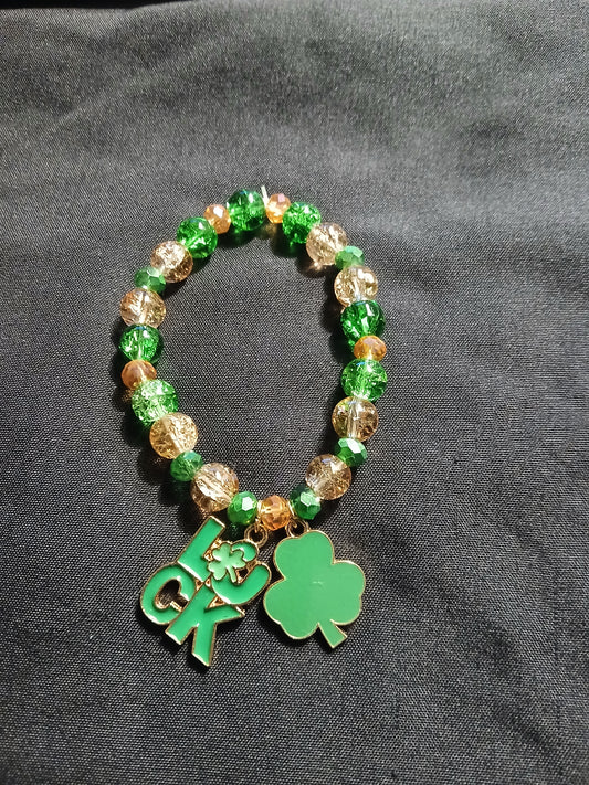 Handmade gold, green and st. Patrick day charm bracelet.