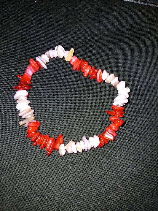 Handmade pink, red and tan sea shell pieces bracelet.