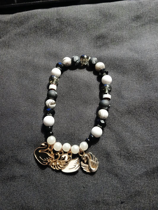 Handmade black, white, clear and gray swan charm bracelet.