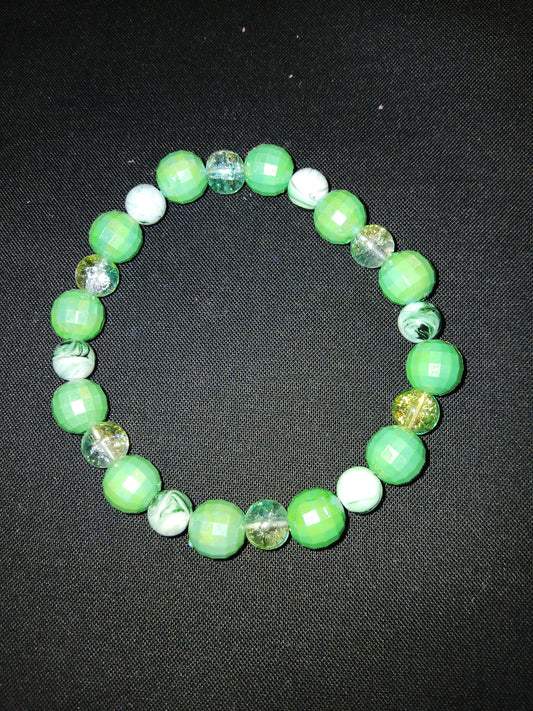 Handmade green, clear, black and white bracelet.