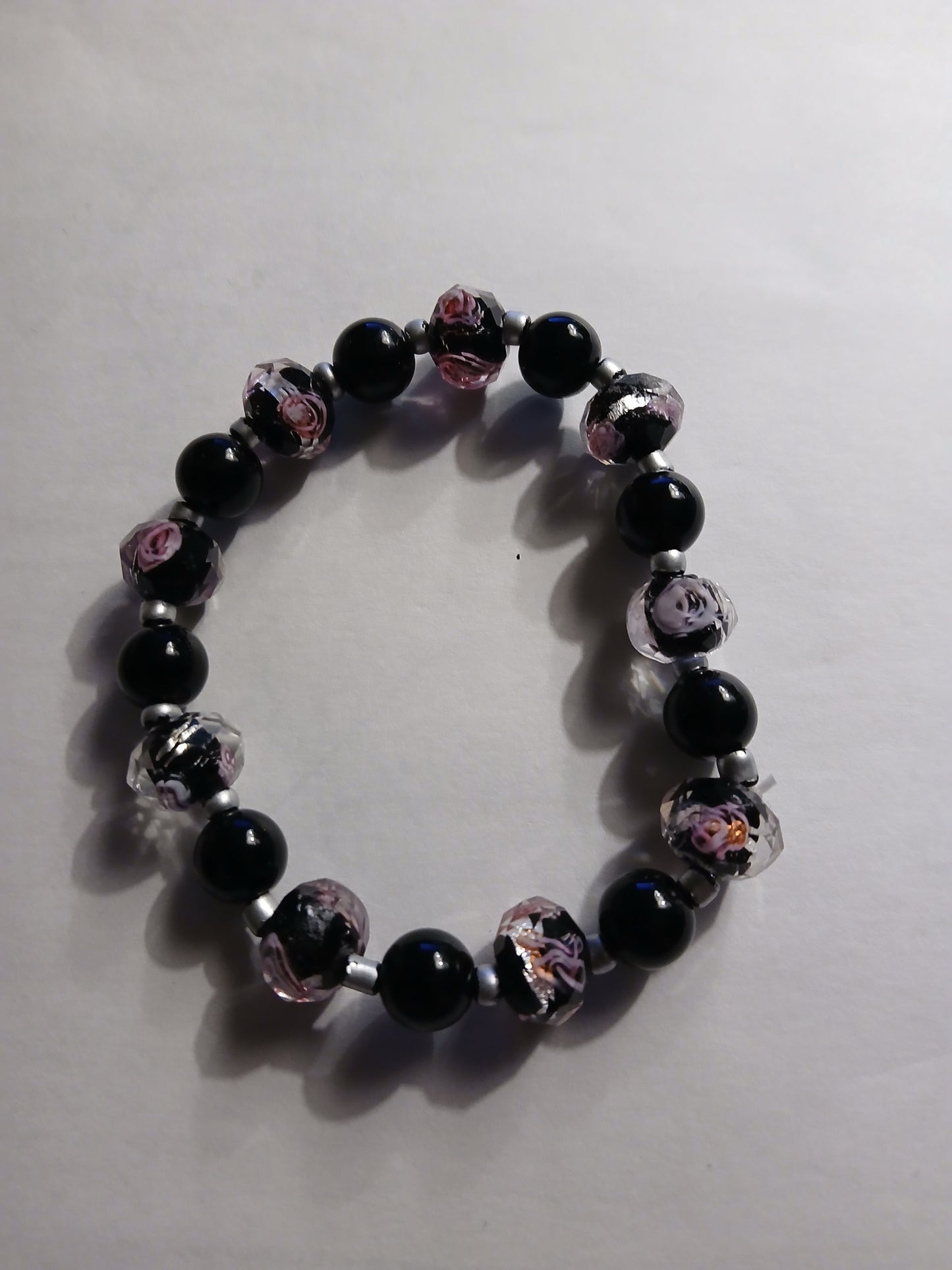 Black , multi colored black,clear and pink homemade bracelet!