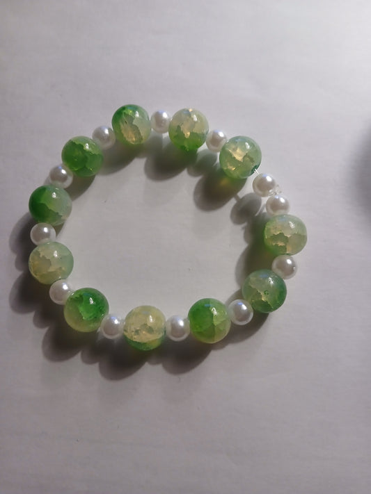 Homemade green and white bracelet.
