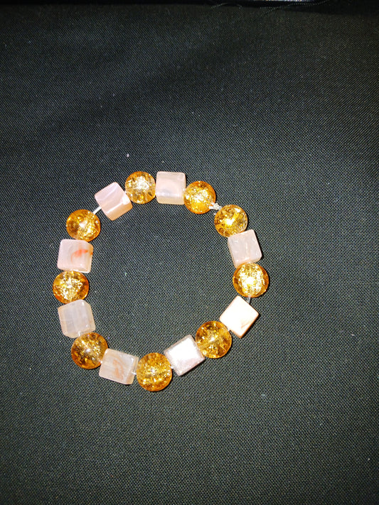 Handmade orange and pale orange bracelet.